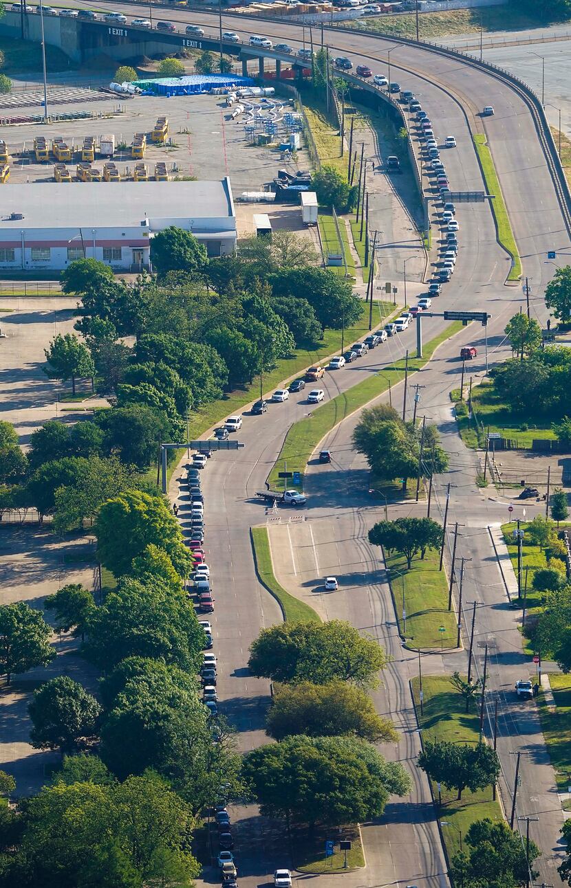Traffic at Fair Park stretched nearly 1.8 miles at one point Thursday as people waited to...