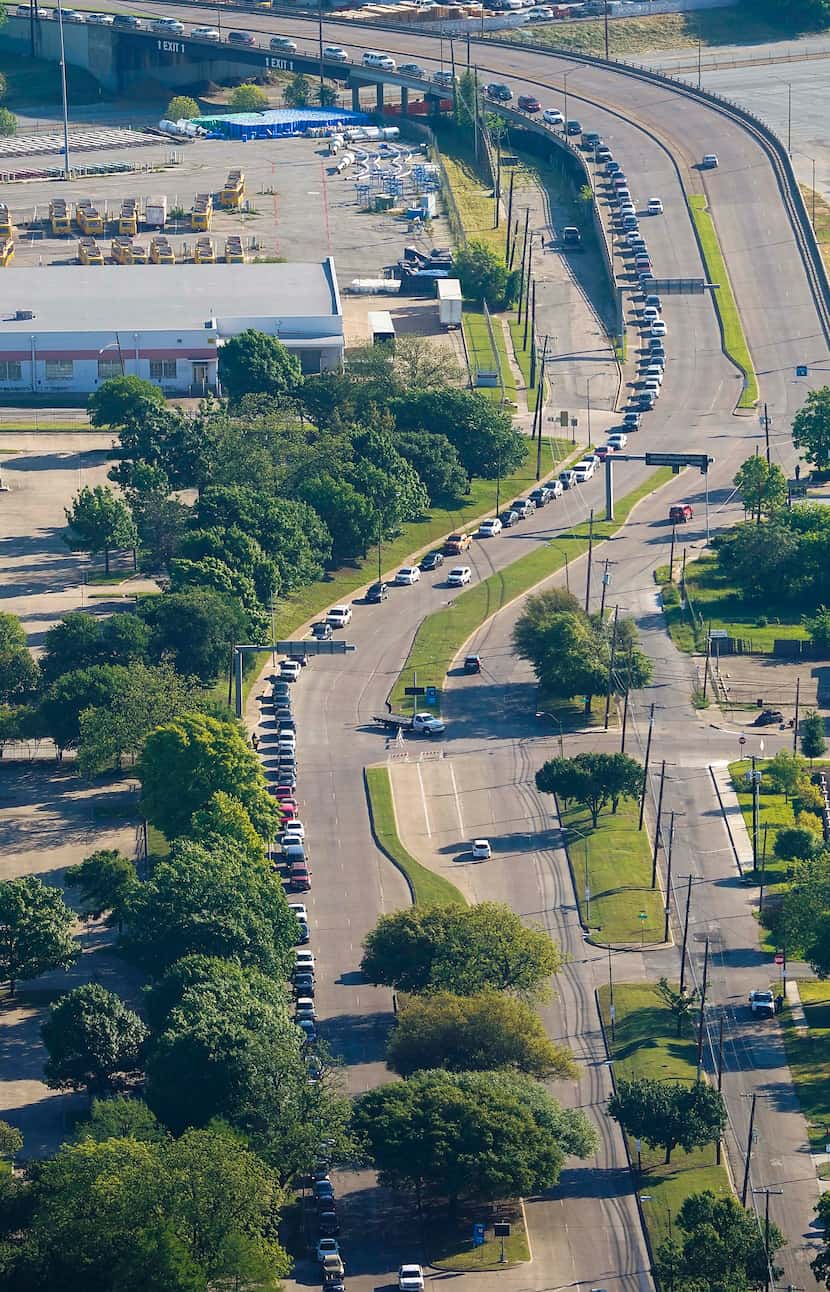 Traffic at Fair Park stretched nearly 2 miles at one point Thursday as people waited to...