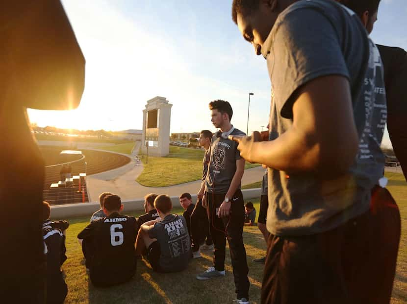 
The Wylie East varsity boys soccer team watches as the school's varsity girls team plays...