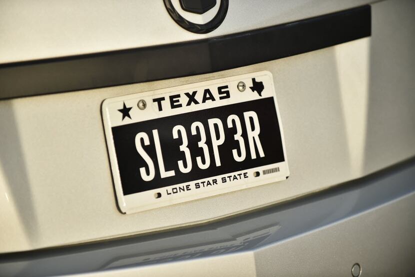 A license plate on a Cadillac CTS-V spelling "sleeper," the term for a car who's outward...