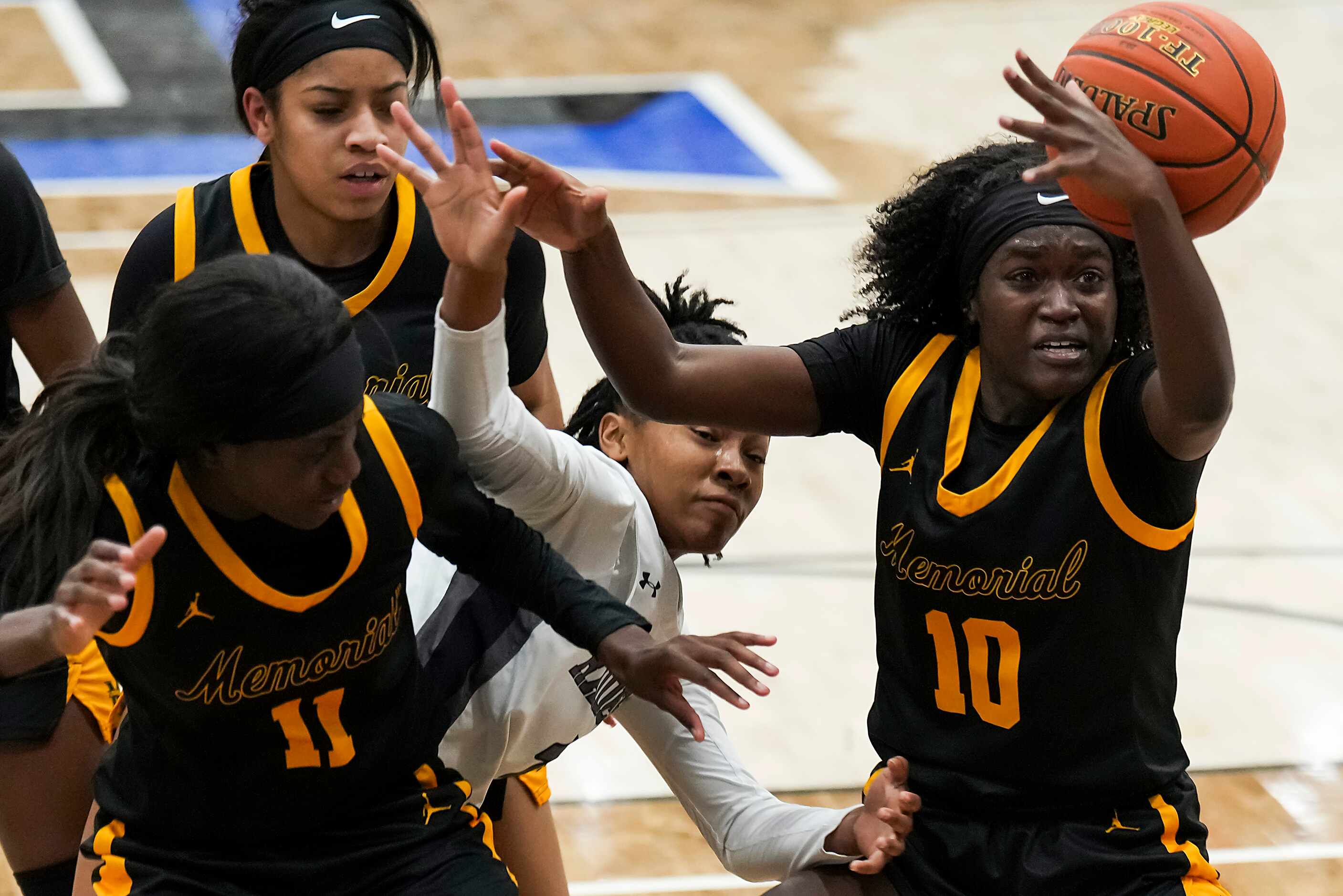 Frisco Memorial's Jasmyn Lott (10) and Falyn Lott (11) fight for a loose ball with Wylie...