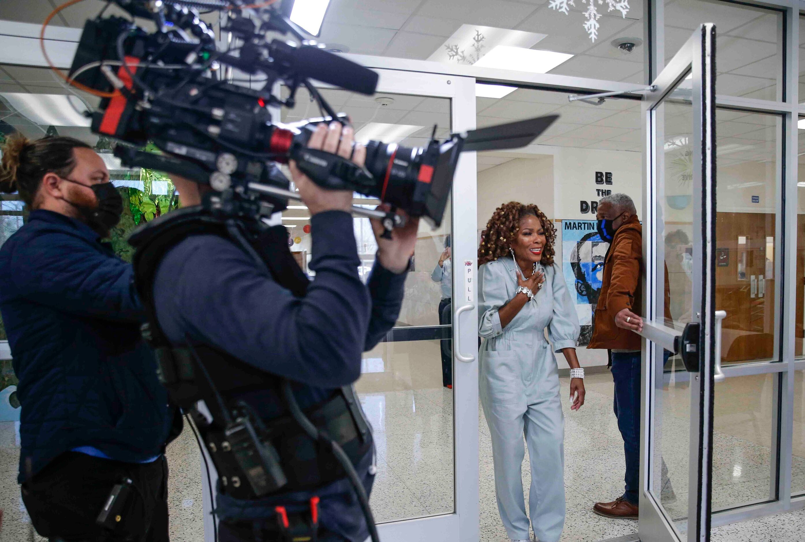 Patricia Byrd, reacts, after seeing Drew Barrymore as a surprise during the recording of an...