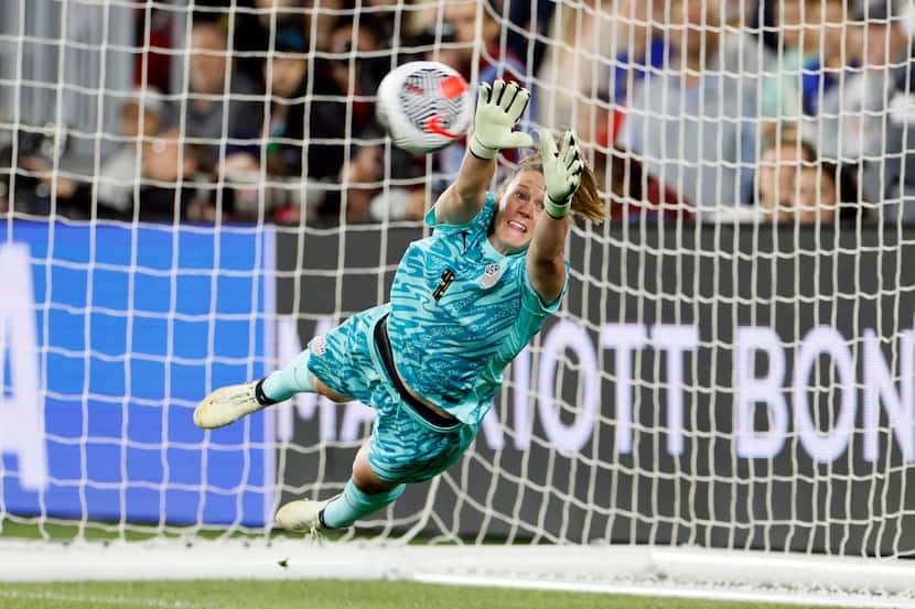 United States' Alyssa Naeher makes a save against Canada during the shoot out of a...