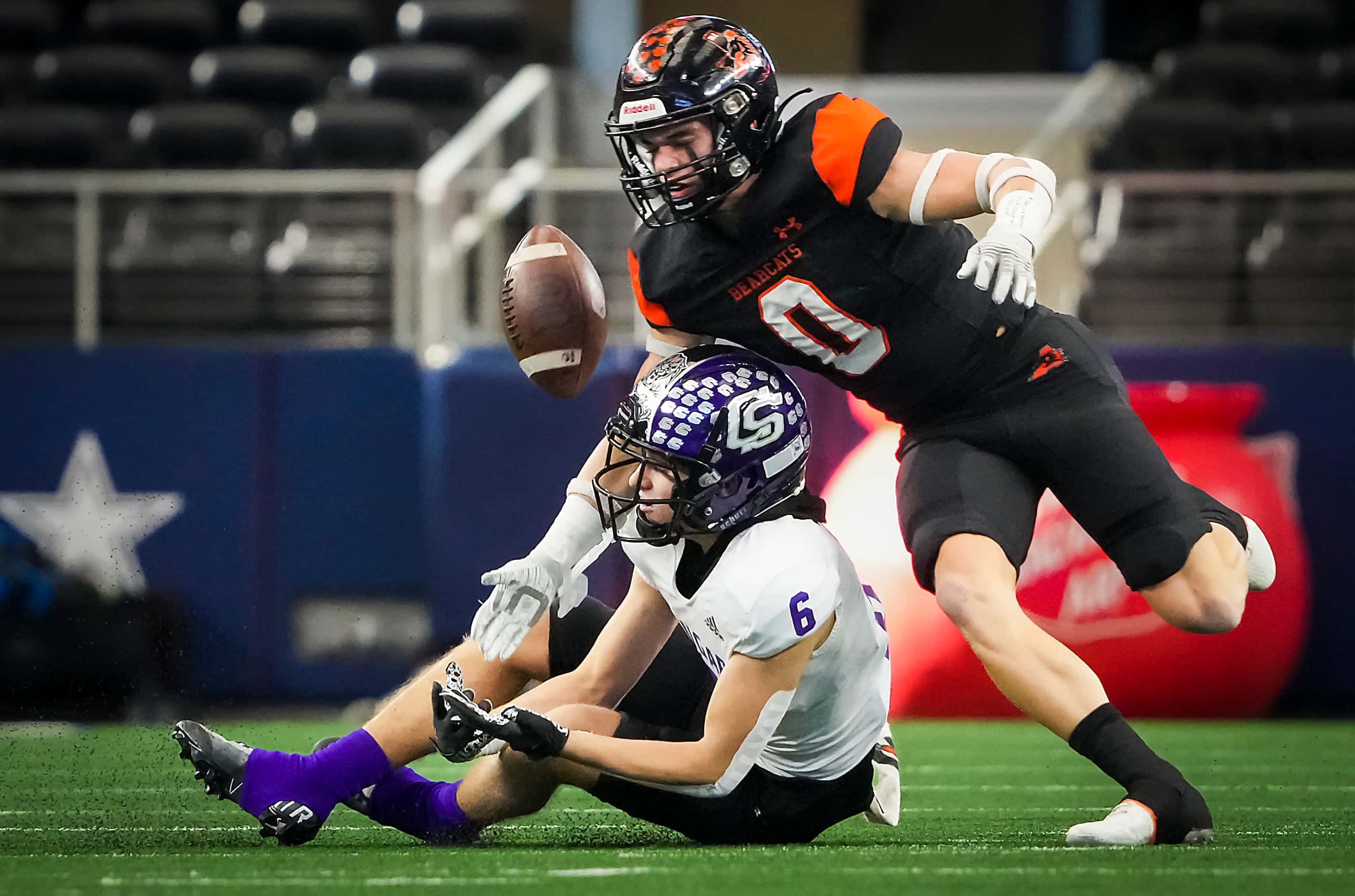 Aledo defensive back Jake Gillespie (0) breaks up a pass intended for College Station wide...