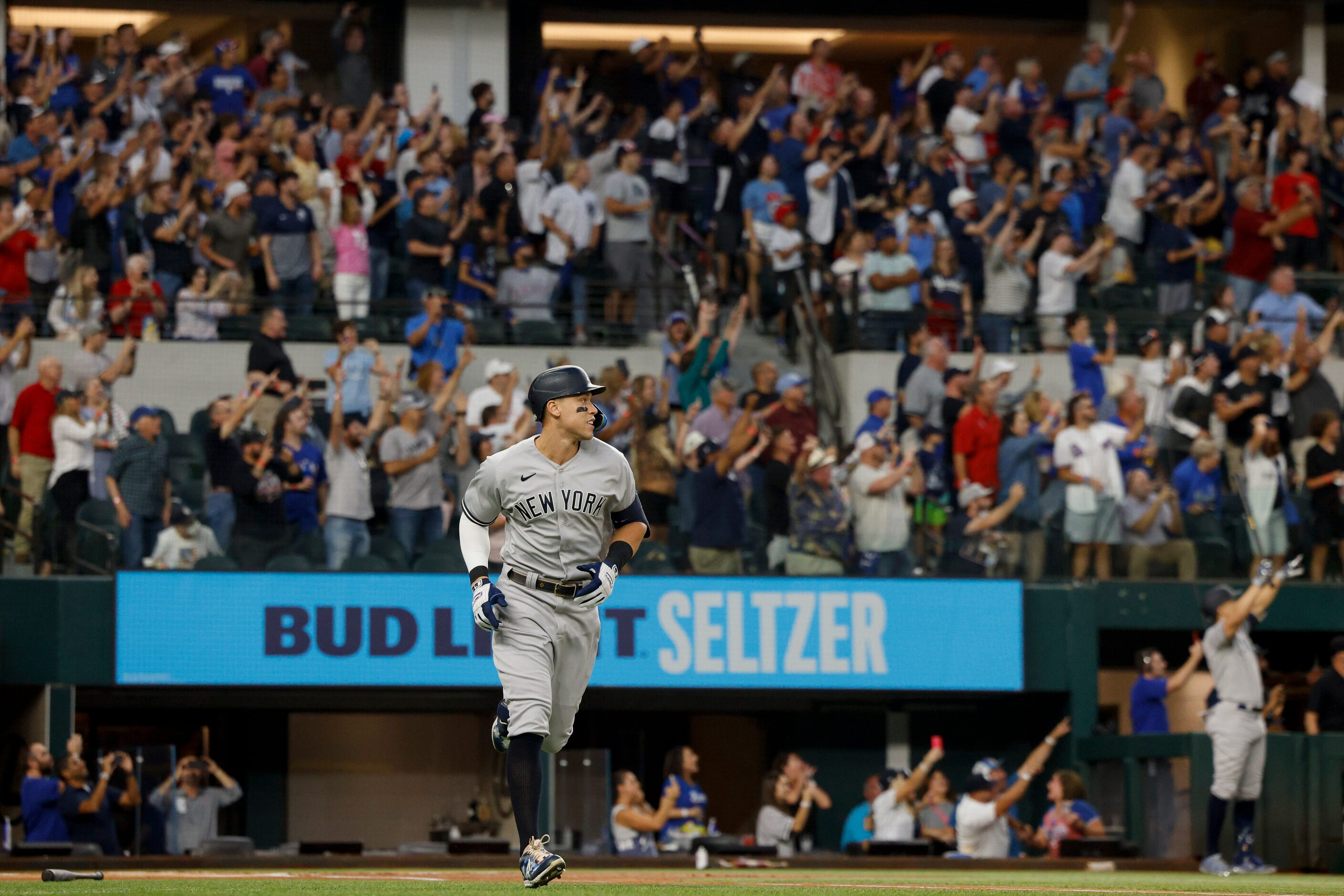 New York Yankees right fielder Aaron Judge (99) watches the ball after hitting a home run to...