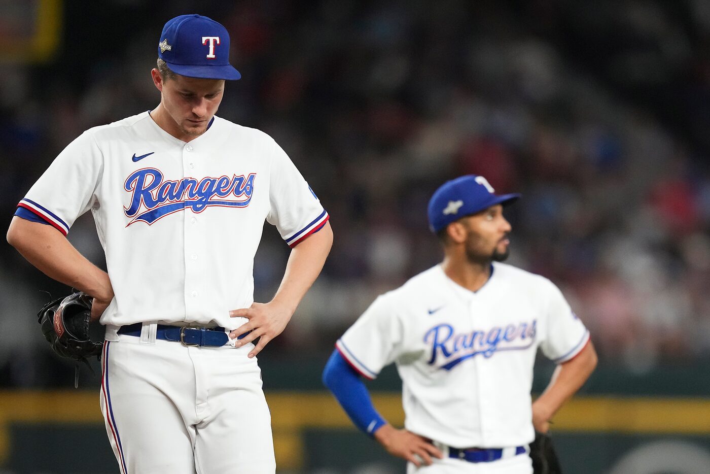 Texas Rangers shortstop Corey Seager (left) and second baseman Marcus Semien wait for a...