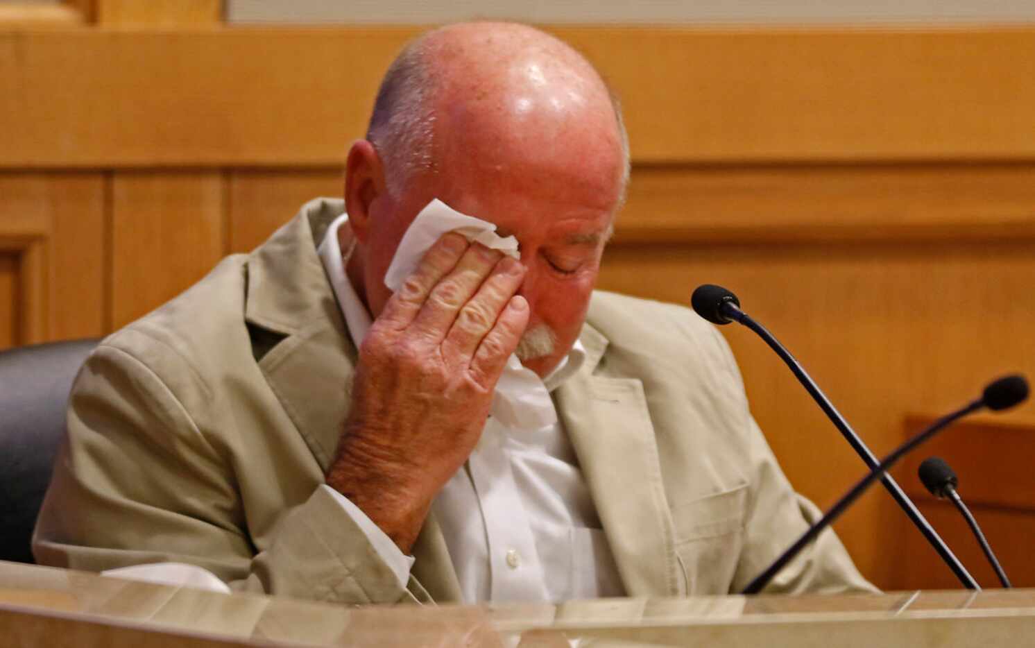 Gary Bardwell wipes away tears away while testifying in Jason Lowe's trial in the murder of...