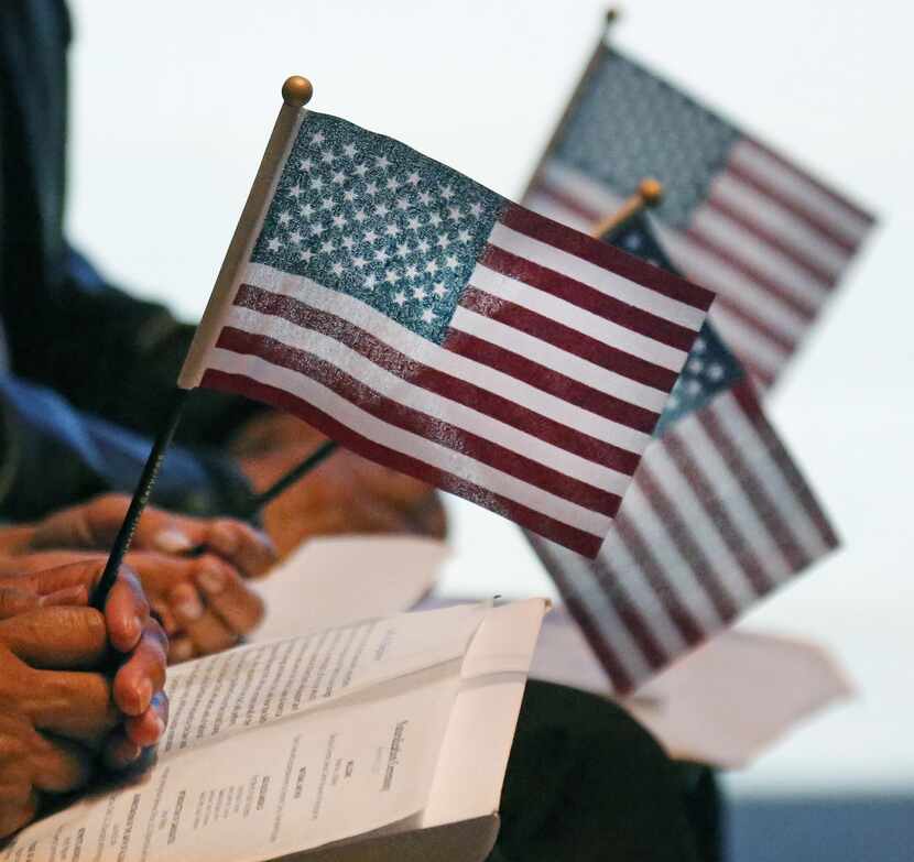 New U.S. citizens are sworn in during a naturalization ceremony on Nov. 20 at the Amon...