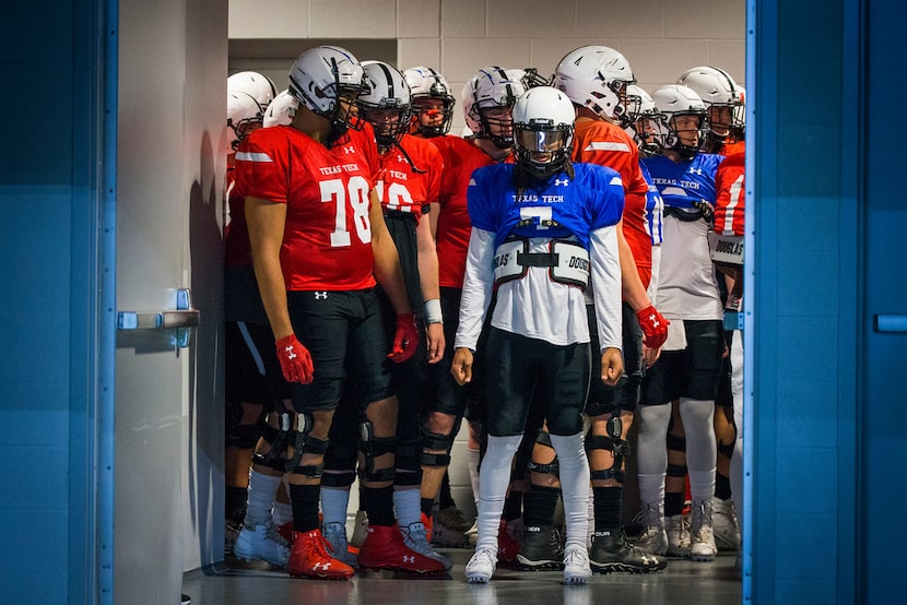 Texas Tech quarterback Jett Duffey (7) and offensive lineman Terence Steele (78) wait to...