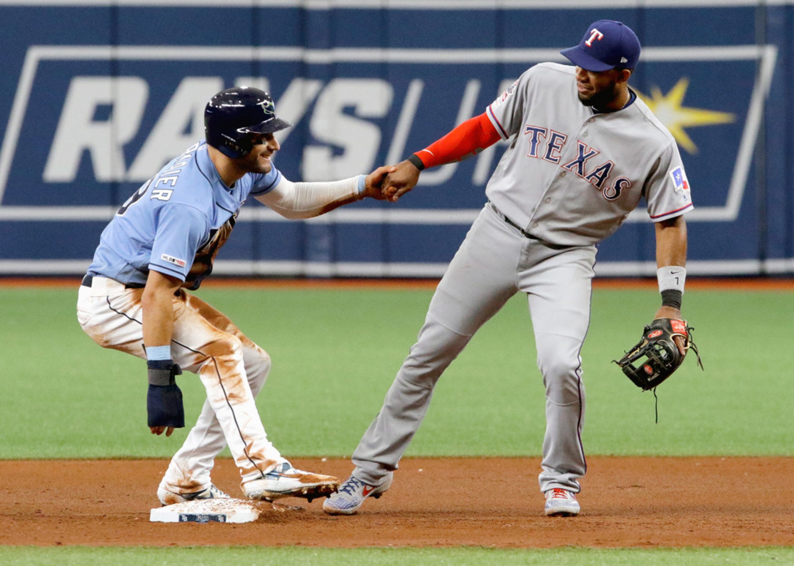 ST. PETERSBURG, FL - JUNE 30:  Kevin Kiermaier #39 of the Tampa Bay Rays is helped up by...