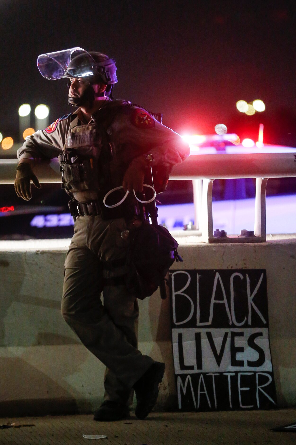 Police surround and detain hundreds of protesters who marched onto the Margaret Hunt Hill...