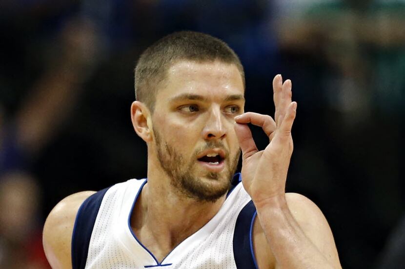 Dallas Mavericks forward Chandler Parsons celebrates a basket during the second half against...