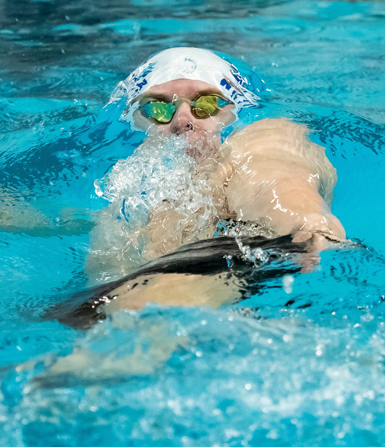 Keller's Maximus Williamson competes in the 200 medley relay during the 2023 UIL Swim & Dive...