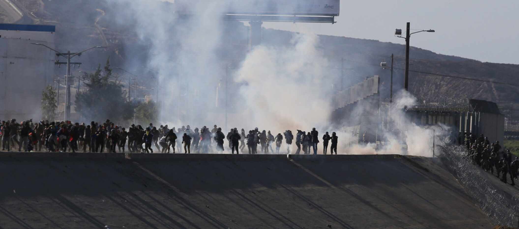 View of tear gas that border police used to prevent groups of people from crossing the...