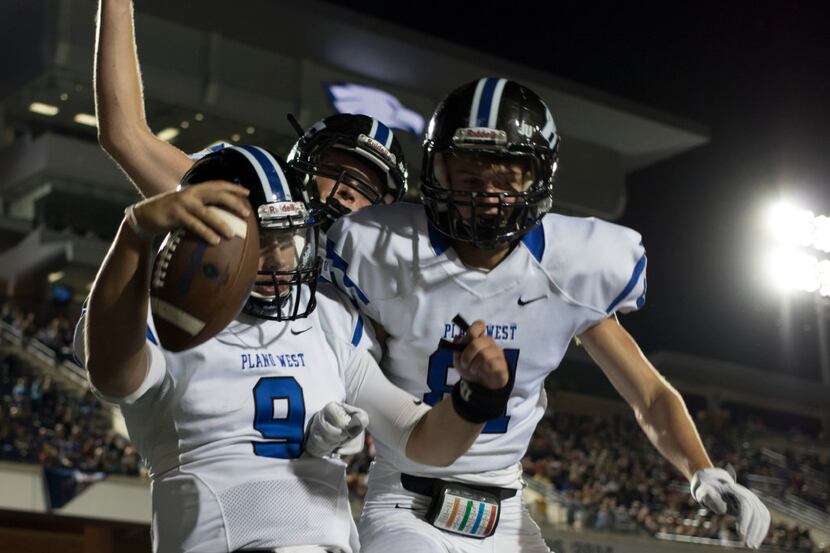 Plano West quarterback Tanner Gillean (9) celebrates a touchdown with teammate Andrew...