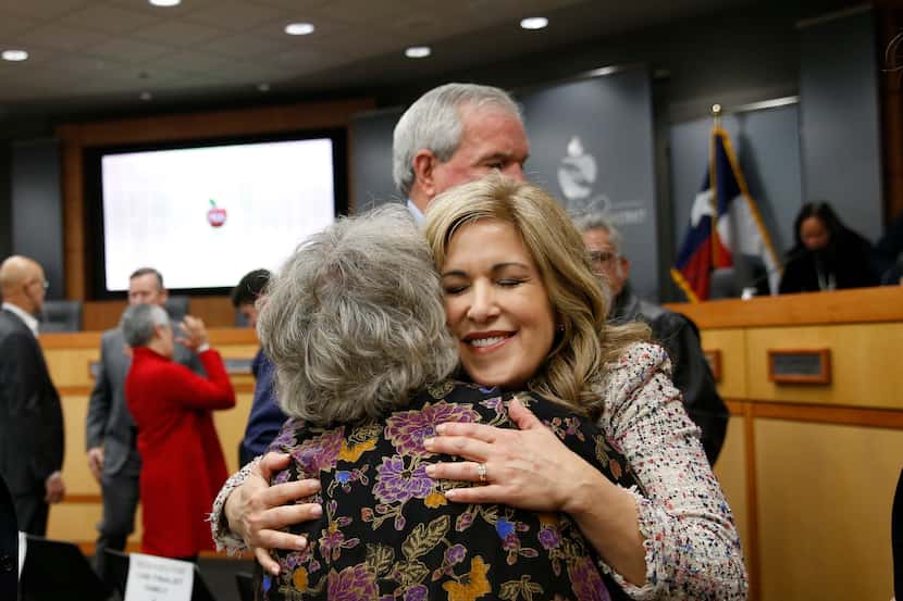 Theresa Williams embraces former Garland ISD administrator Aretha Burris after a special...