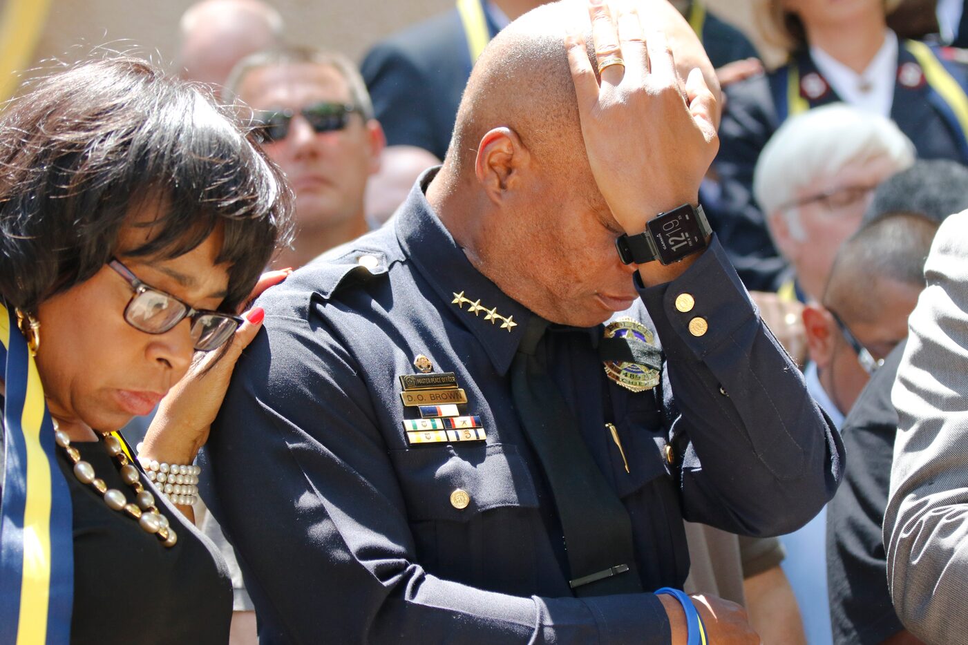 Dallas Police Chief David Brown pauses at a prayer vigil during a citywide prayer service in...