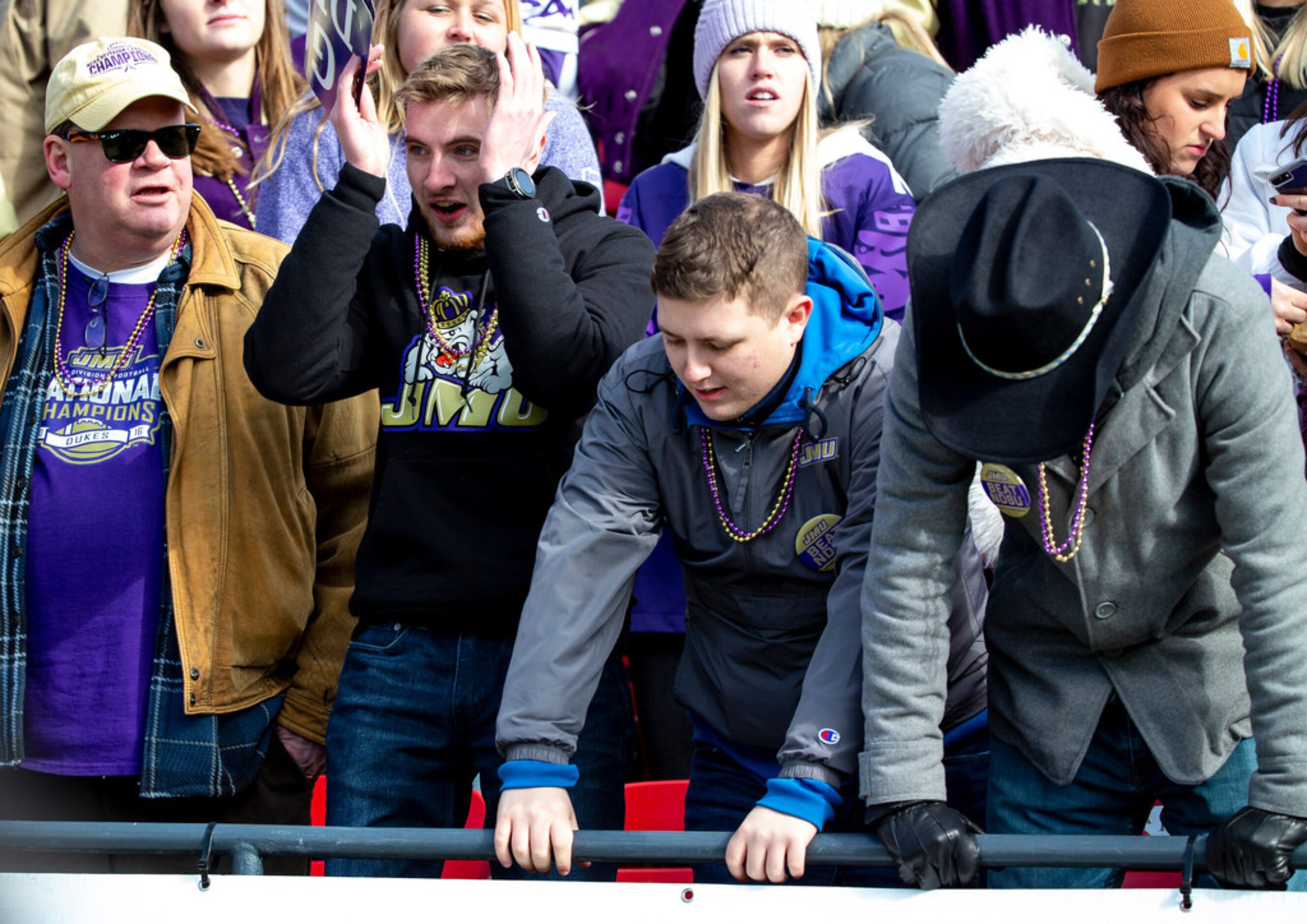 James Madison fans react after their team failed to convert on a fourth down attempt during...