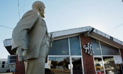  A plaque affixed to a statue of Soviet icon Vladimir Lenin erected outside Harvey Gough's...