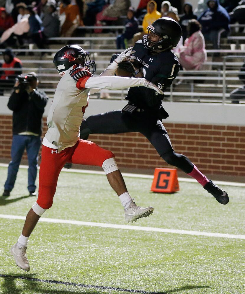 Mansfield Lake Ridge wide receiver Malik Knowles (18) catches a touchdown pass during a...