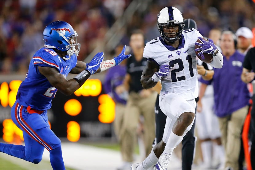 TCU Horned Frogs running back Kyle Hicks (21) is forced out of bounds by Southern Methodist...