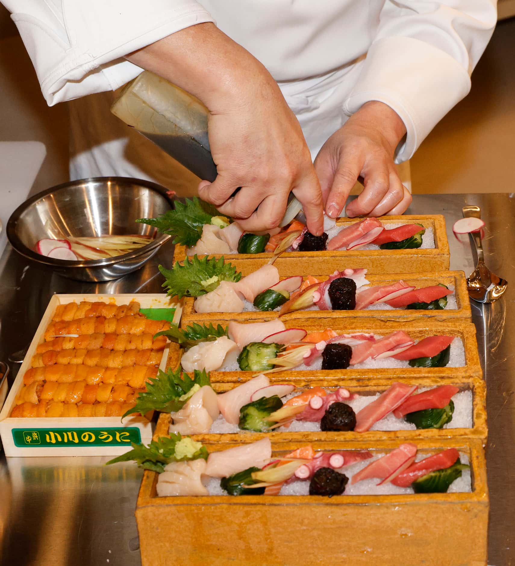 Chef Masayuki Otaka prepares sashimi dishes at his new Japanese restaurant Mabo. The...