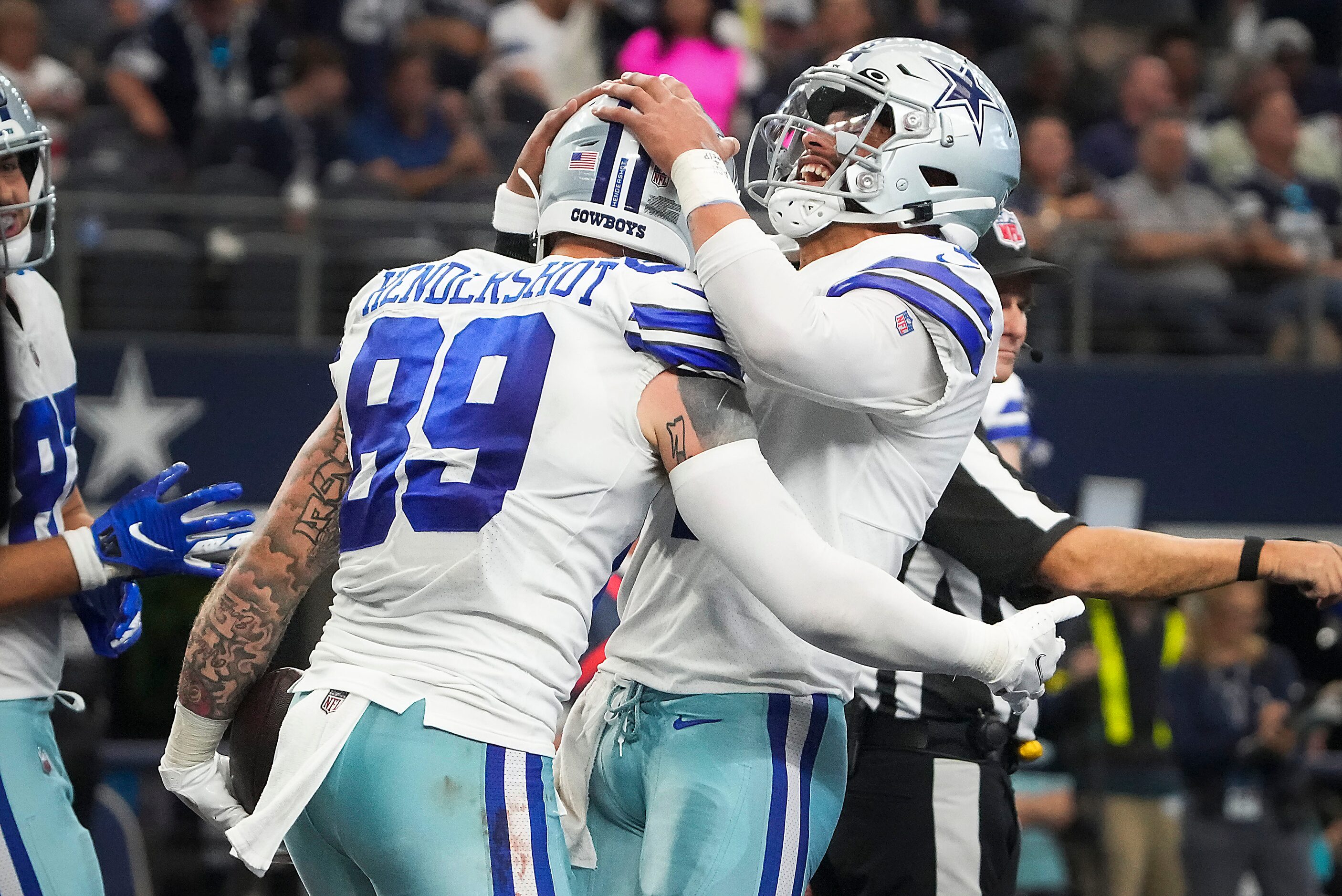 Dallas Cowboys quarterback Dak Prescott (4) celebrates with tight end Peyton Hendershot (89)...