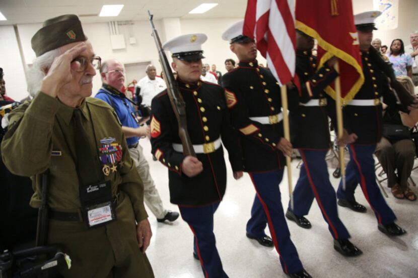 Robert Blatnick, a veteran of World War II, saluted as a color guard passed by during the...