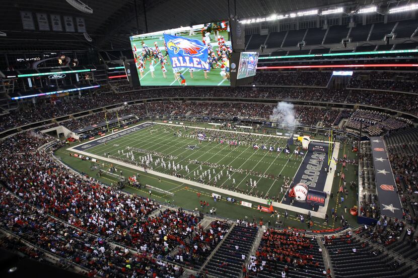 The teams take the field before the Class 5A Division I football state championship game...