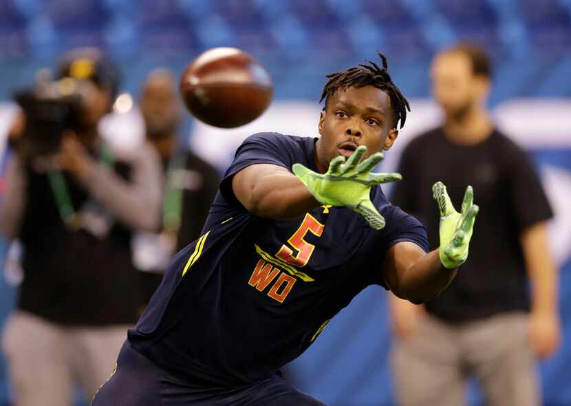 Ohio State wide receiver Noah Brown runs a drill at the NFL football scouting combine in...