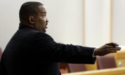  Dallas County Assistant District Attorney Russell Wilson on Feb. 14, 2013, while defending...