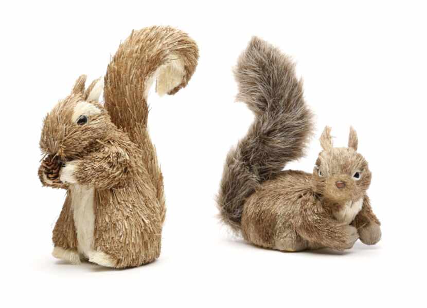 Nuts: Fanciful squirrels of dried grass and bark nest among limbs on a Christmas tree or...