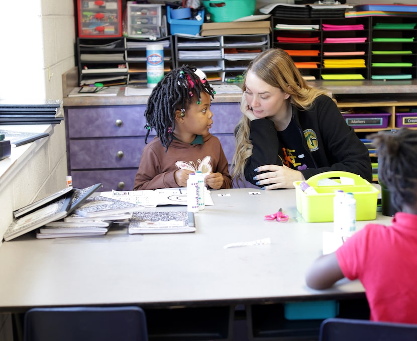 4-year-old Serenity Stubblefield, left, and Colleen Farrisee work on a project at Arthur...