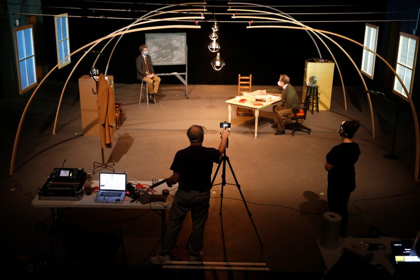 Playwright Mark Oristano adjusts the camera during a rehearsal for 'The Impact of the Gadget...