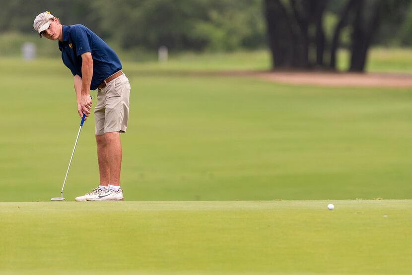 Highland Park's Austin Morrow putts on the 5th green during round 1 of the UIL Class 5A boys...