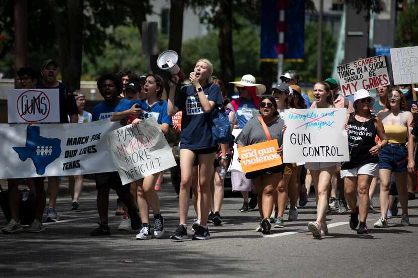 Dallas March for Our Lives organizers Karter Stanton, Naz Soysal and James Thompson lead...