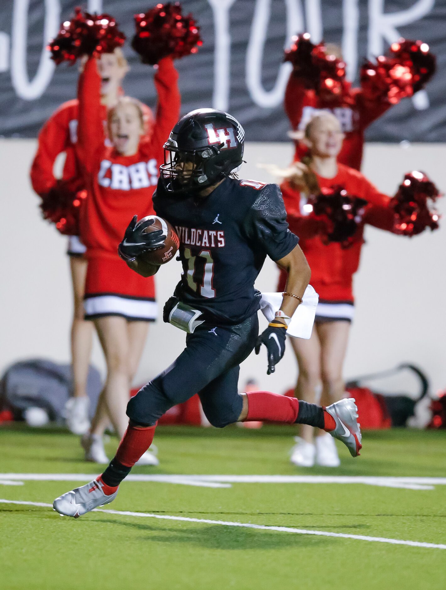 Lake Highlands junior wide receiver Shamar Donaldson (11) carries a pass in for a touchdown...