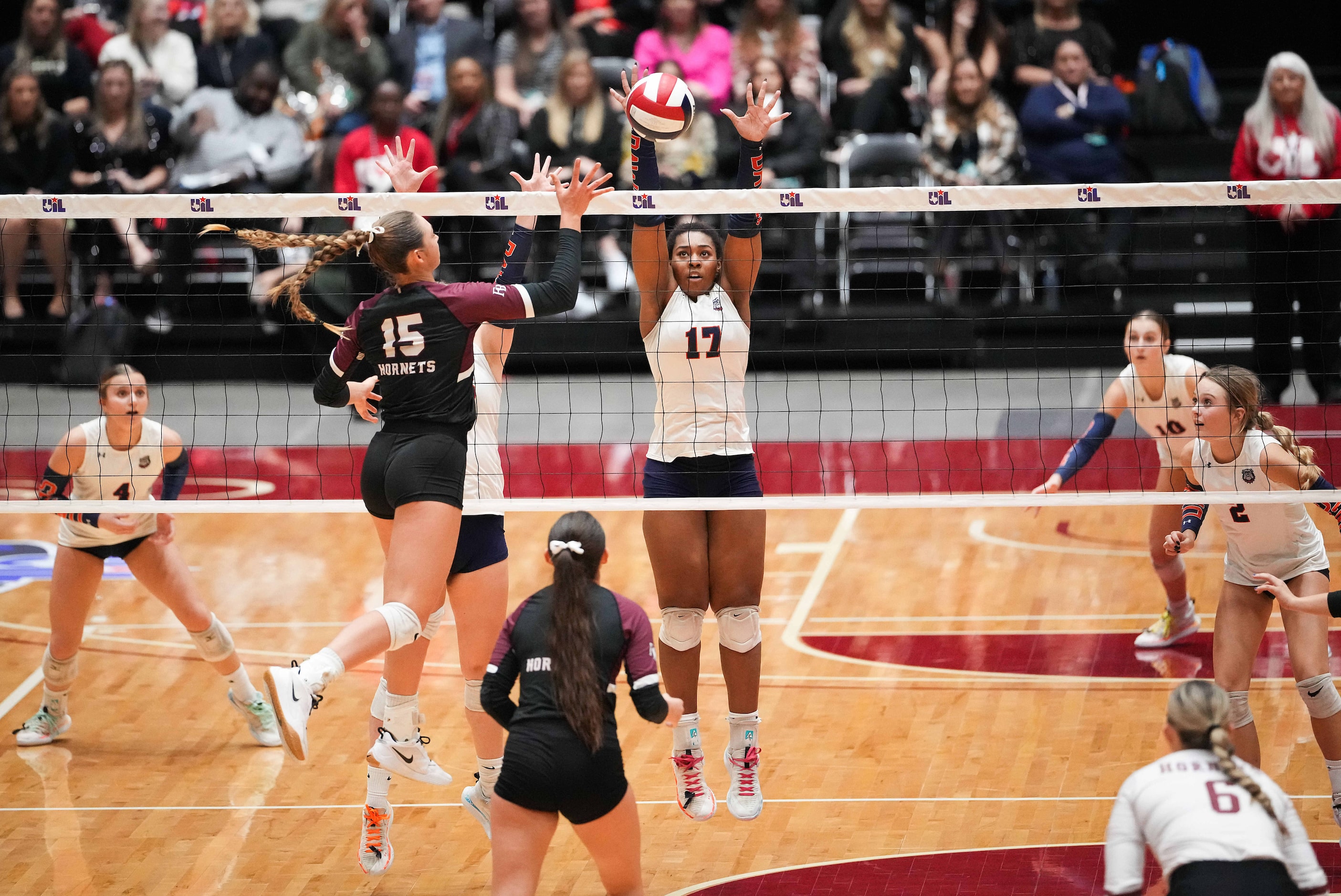 Corpus Christi Flour Bluff's Margaret Croft (15) hits around the block of McKinney North's...