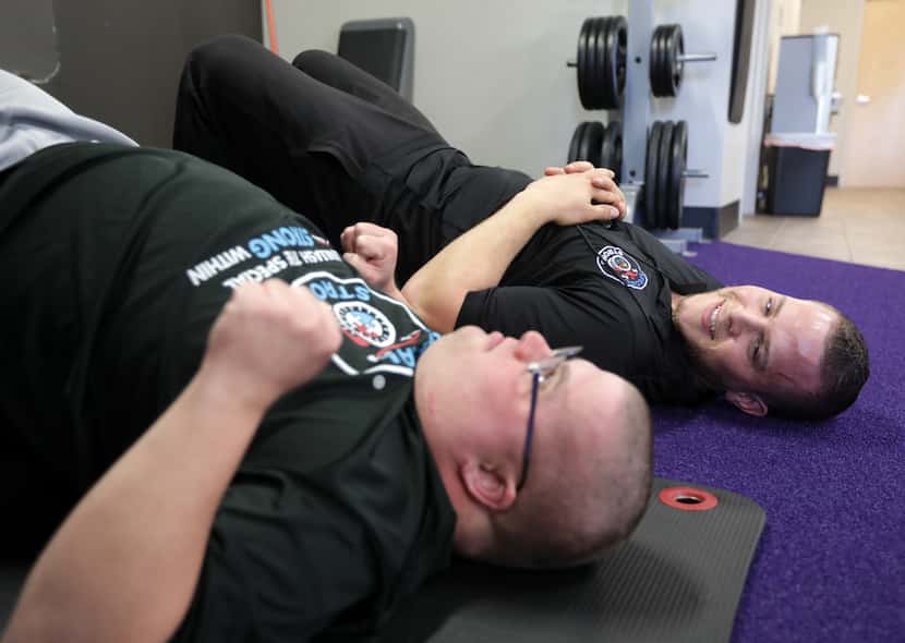 Josh Walters, 28, (left) and Daniel Stein with Special Strong exercise at Anytime Fitness in...