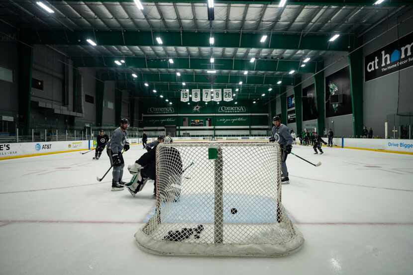 Blake Comeau (left) and Tyler Seguin (right) take shots at Dallas Stars' first training camp...