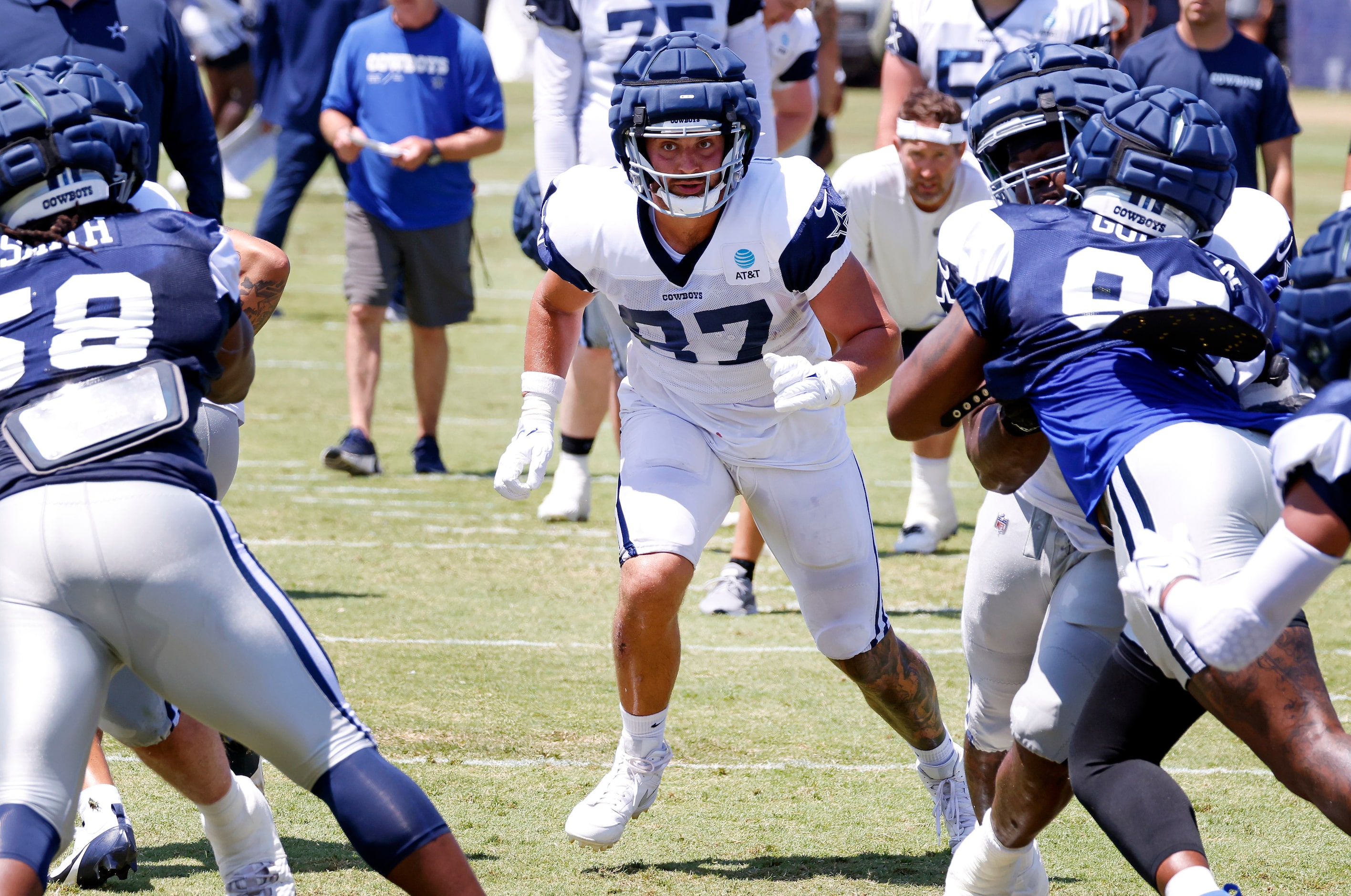 Dallas Cowboys tight end Jake Ferguson (87) looks to block during a running play during a...