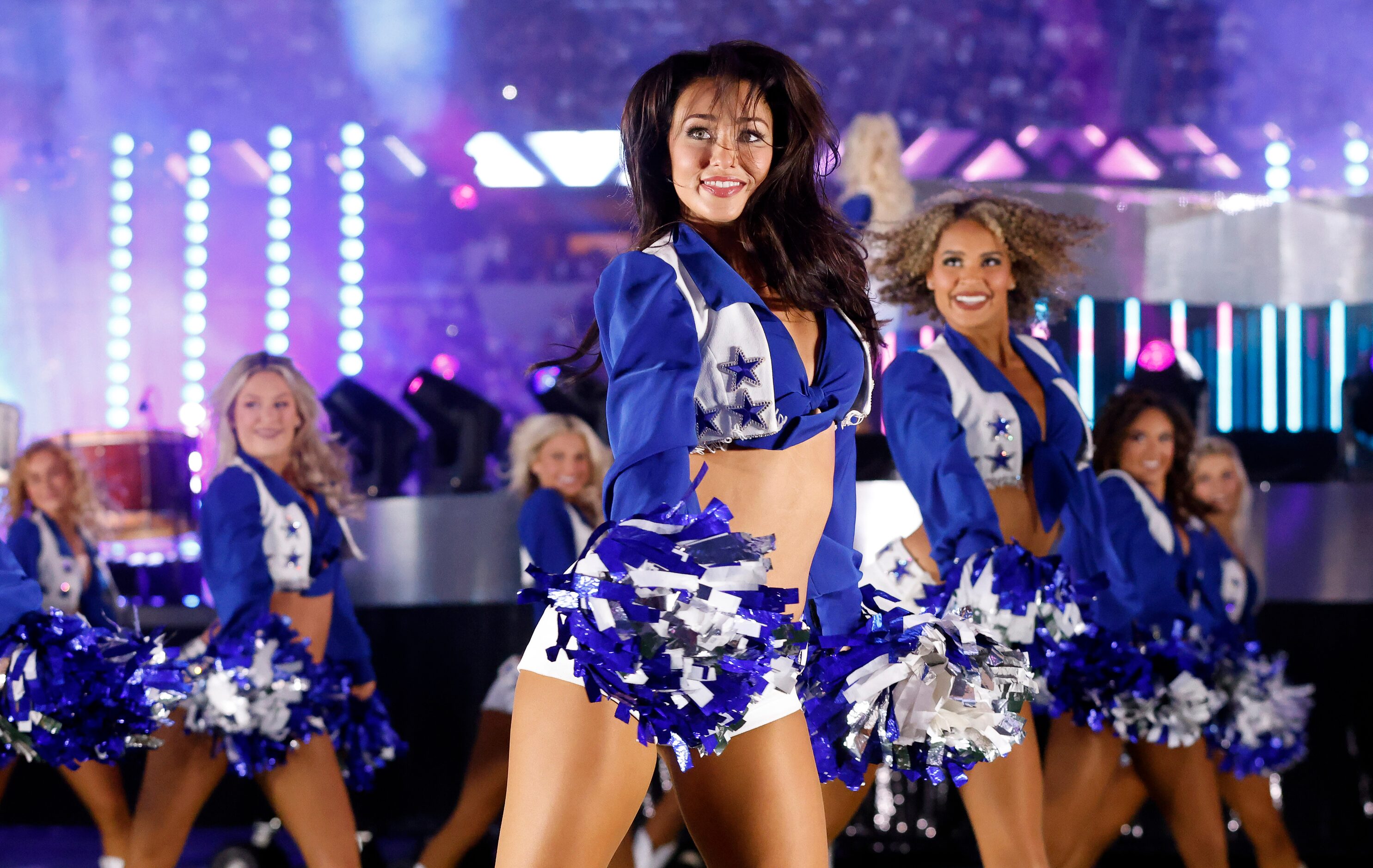 The Dallas Cowboys Cheerleaders perform during the Thanksgiving Day halftime show with...