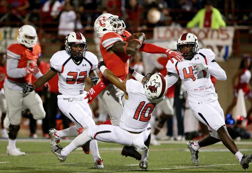 FILE - Duncanville quarterback Jaylin Nelson (5) is tackled by Cedar Hill cornerback Ja'rod...