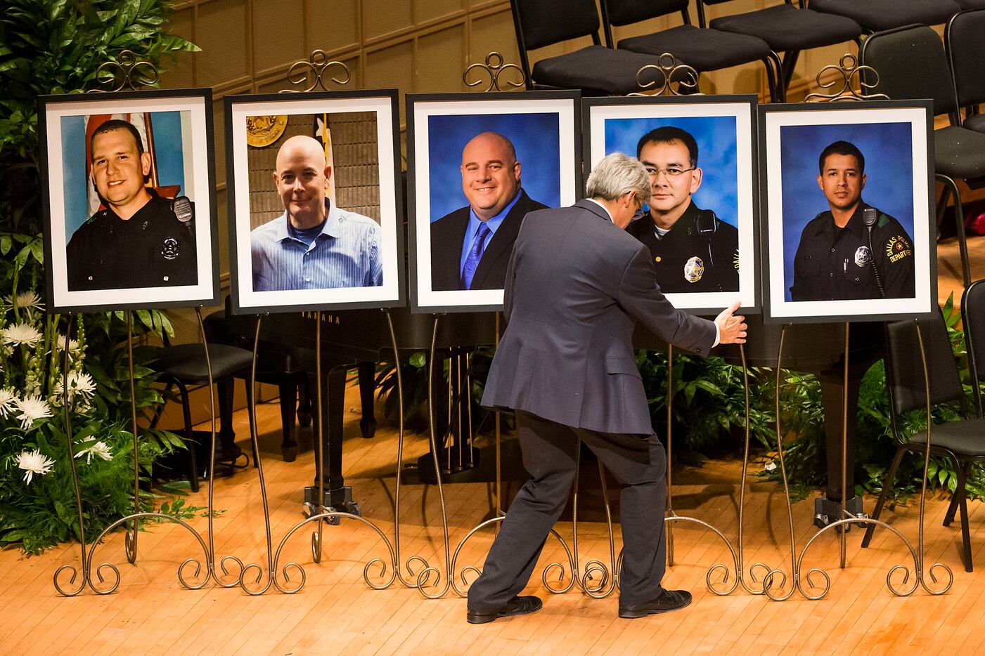 Portraits of the five law enforcement officers killed earlier this month in an ambush were...