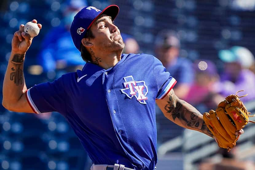 Texas Rangers pitcher Hans Crouse delivers during the fifth inning of a spring training game...