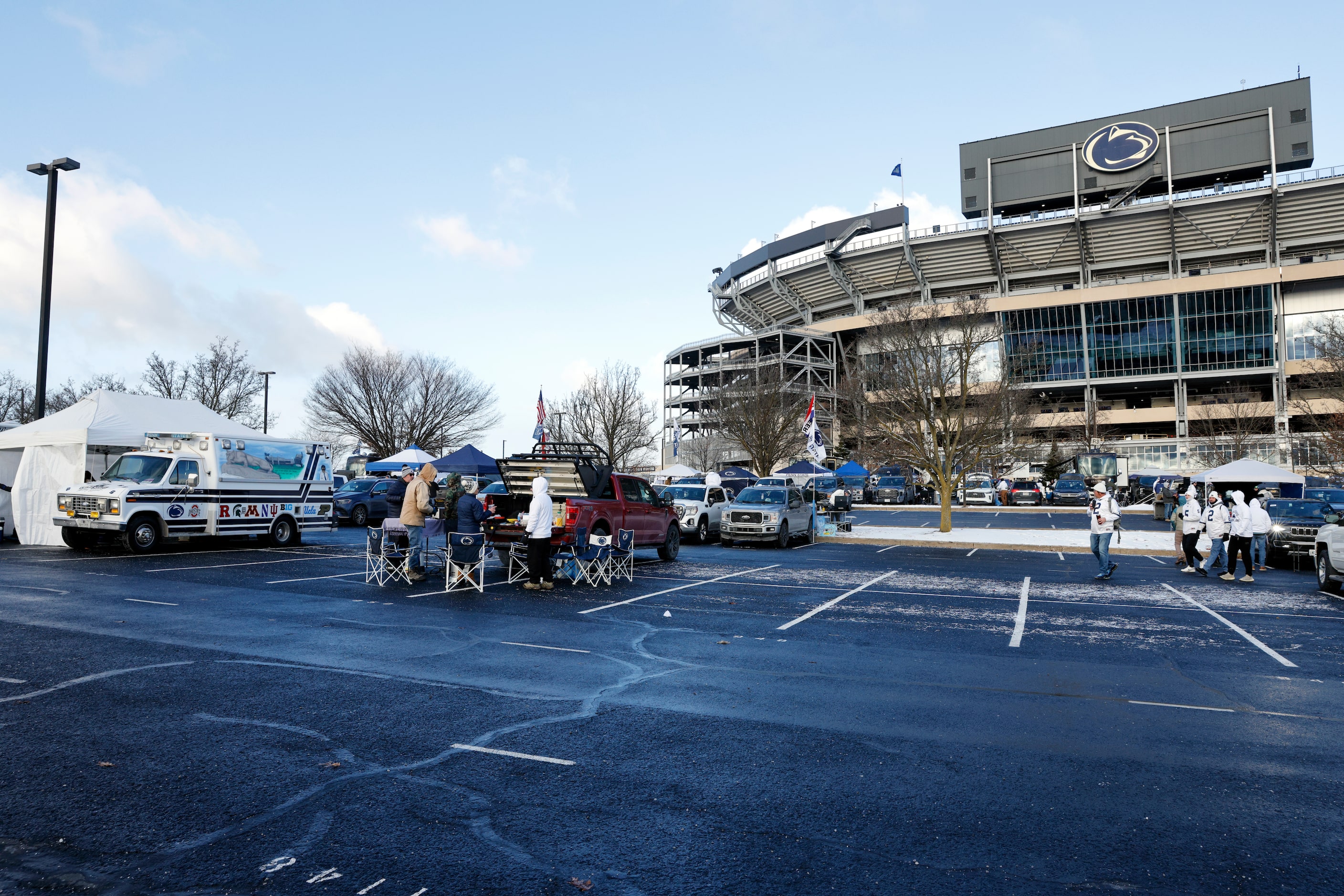 Fans tailgate outside Beaver Stadium before a game between SMU and Penn State in the first...