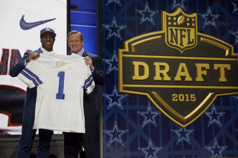 Connecticut defensive back Byron Jones poses for photos with NFL commissioner Roger Goodell...