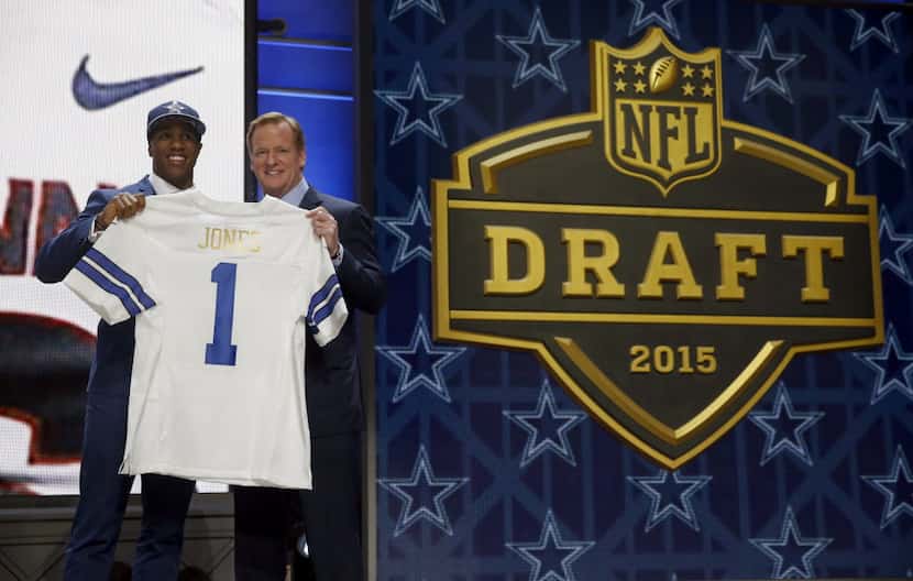 Connecticut defensive back Byron Jones poses for photos with NFL commissioner Roger Goodell...
