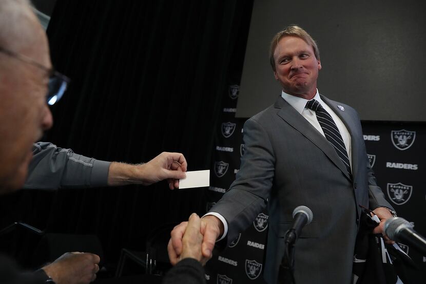 ALAMEDA, CA - JANUARY 09:  Oakland Raiders new head coach Jon Gruden greets reporters during...