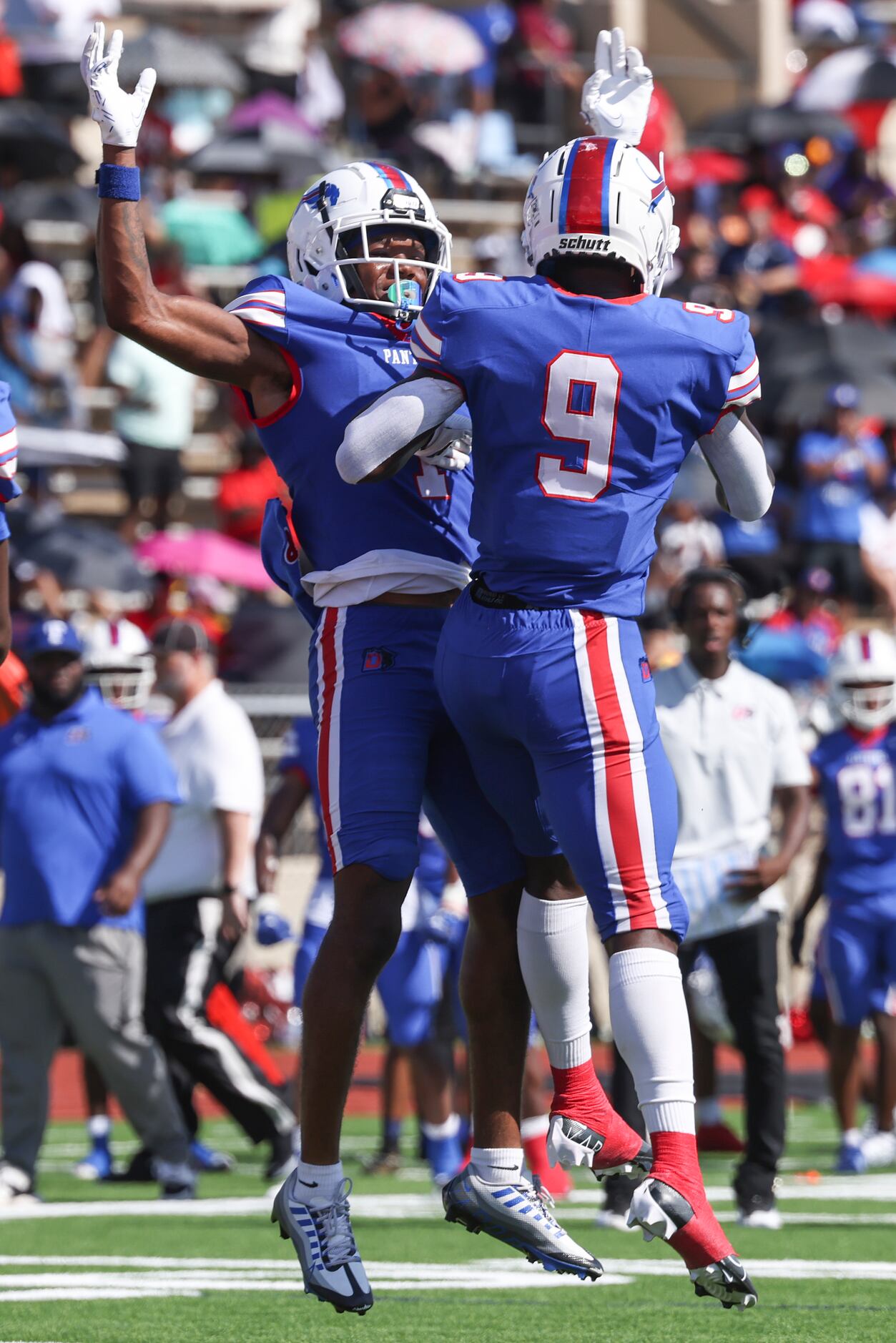 Duncanville High School Lontrell Turner (1) and Kaleb Kenney (9) jumps into the air...